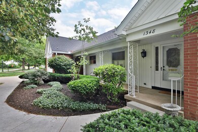 White ranch with landscaped entry at 1348 Haddon Rd, Columbus